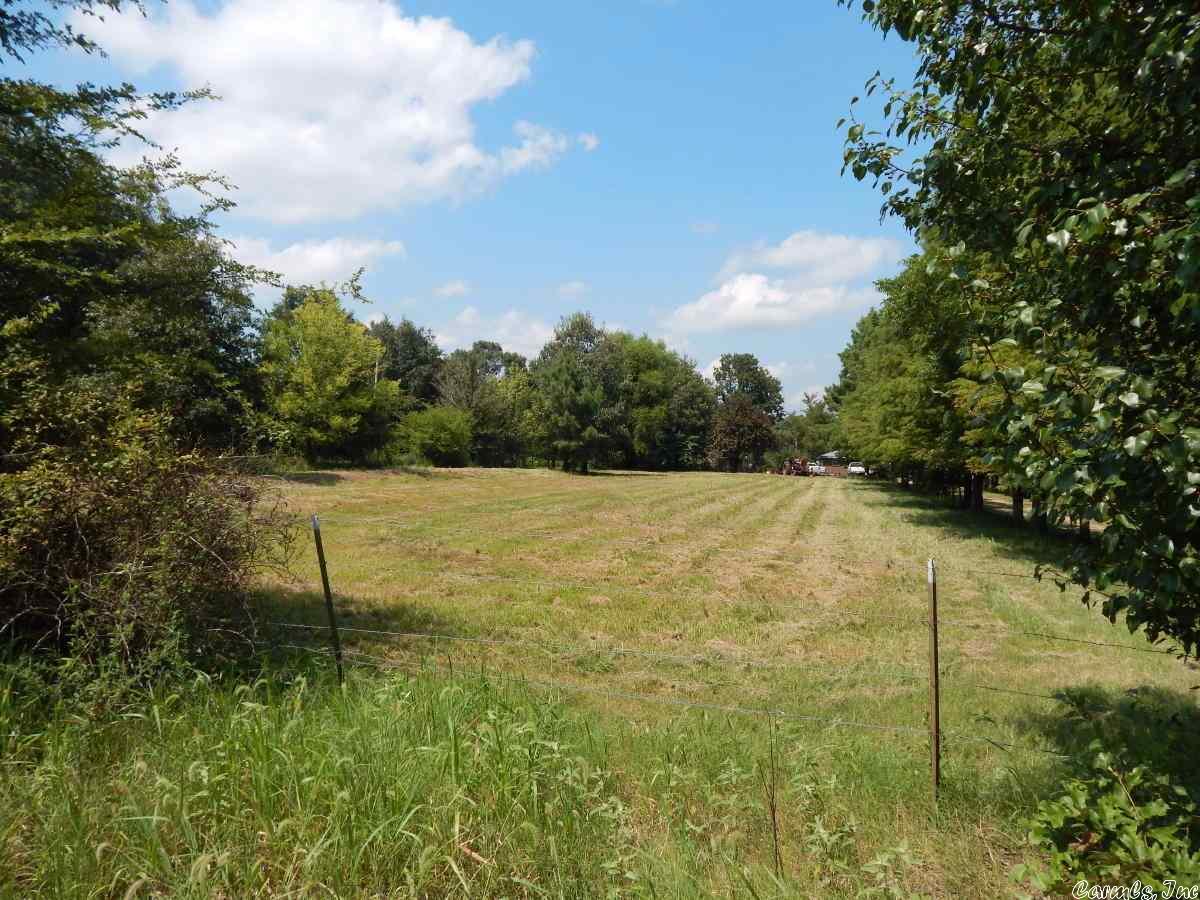 Brookland School District...Beautiful hill acreage fronting Peachtree and adjoining Sage Meadows. Part in city, part in county. City water & light, some nice pasture areas, two small ponds, beautiful shade trees, water line & small creek through the acreage, one heavily wooded area, easy paved road access with multiple building sites.