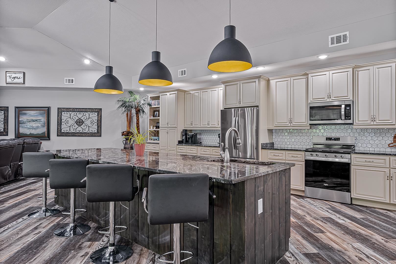 Modern Elegance Meets Natural Beauty on 9 Private Acres. Welcome to 8203 Oak Creek, a stunning custom-built, all-brick home completed in 2023, nestled on 9 acres in the scenic Ridgewood Estates along Crowley's Ridge. Thoughtfully designed with a contemporary aesthetic, this home showcases open spaces, soaring ceilings, and an abundance of natural light perfectly complemented by serene, wooded surroundings and abundant wildlife. Step inside to find 13-foot ceilings, waterproof luxury vinyl plank flooring, and beautiful granite countertops. The kitchen is as functional as it is stylish, featuring built-in accents, elegant drop-down lighting, and an abundance of cabinetry to meet all your storage and entertaining needs. A west-facing front door fills the home with warm afternoon light, while a full-height concrete rear wall offers enhanced storm protection (a smart and stylish safeguard for Arkansas weather). Enjoy cozy evenings by the striking living room fireplace, adorned with soldier-pattern brickwork and a bold oversized mantle. The gourmet kitchen, spa-like primary bath with a deep soaker tub, and finished attic space above the garage offer comfort and versatility at every turn.