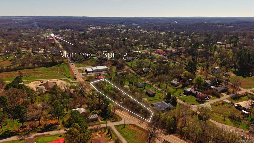 Take a look at these nine lots located directly on Main Street in Mammoth Spring, Arkansas, offering excellent highway frontage and a prime position right at the edge of town. With access to electric and city water, these parcels are well suited for residential builds, investment opportunities, or commercial development. A wet weather creek runs along the back of the property, adding a natural touch to the setting. This location places you near Mammoth Spring, a National Natural Landmark producing millions of gallons of water per hour, feeding into the Spring River, well known for trout fishing and floating. Nearby, you will find Mammoth Spring State Park with walking trails, picnic areas, and a historic train depot museum, along with the National Fish Hatchery offering educational exhibits and tours.