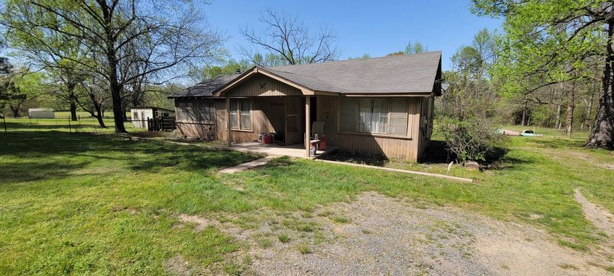 Perfect starter home or future income property. Beautiful 3.10 grassy acres with a pond. Farmhouse offers 3 bedrooms and 1 bath, as well as a large heated and cooled bonus room that can be used as an additional office, living room, or bedroom. Open porch in front of home allows for a quiet resting space. With some work this can be your dream home! Refrigerator, washer, dryer, 20x28 workshop and two storage buildings convey. Brand new dishwasher installed in the kitchen May, 2024. Newer HVAC system installed within the last two years. Piers have been completely redone. Now all this home needs is your touch to renovate it and make it your home.