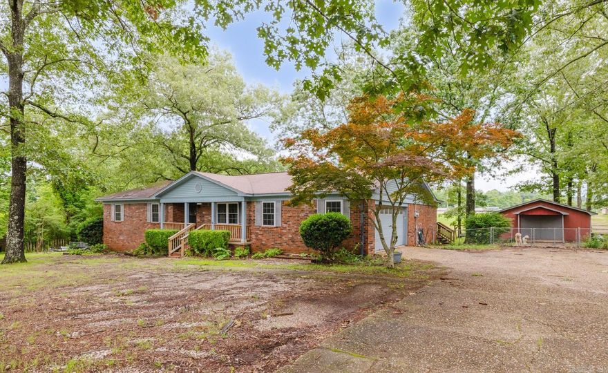 Welcome to this beautifully remodeled 3-bedroom, 2-bath brick ranch-style home on nearly 1 acre in the desirable Salem community. Huge 36X24 shop! Spacious living area with a gorgeous vaulted ceiling, exposed wood beams, LVP flooring and beautiful fireplace. The kitchen is both functional and stylish, featuring granite countertops, stainless steel appliances, a gas stove, breakfast bar, and an abundance of cabinet space. Beautiful dining area with built-ins that provides plenty of room for entertaining. The home also includes a large mudroom/pantry, granite in all wet areas, fresh paint throughout, new light fixtures, and new carpet in bedrooms. Step outside to enjoy the expansive covered back deck overlooking a fully fenced yard, perfect for relaxing or hosting guests. Conveniently located near shopping, restaurants, and the interstate for an easy commute. Zoned for Bryant Schools, including Salem Elementary and Bethel Middle.
