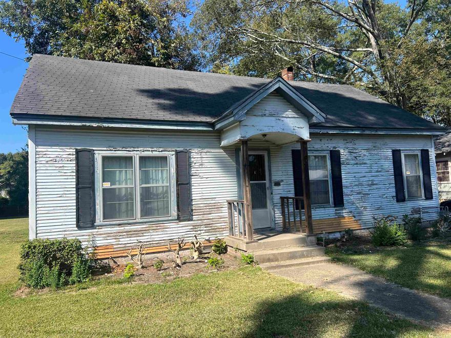 Nicely kept three bed two bath home. This home has a 20x37 shop perfect for storage, and hobbies situated on a half acre fenced in yard, tongue and groove pine paneling, spacious bedrooms, nice size kitchen, formal dining room, formal living room with gas log fire place and a cozy den with built ins.