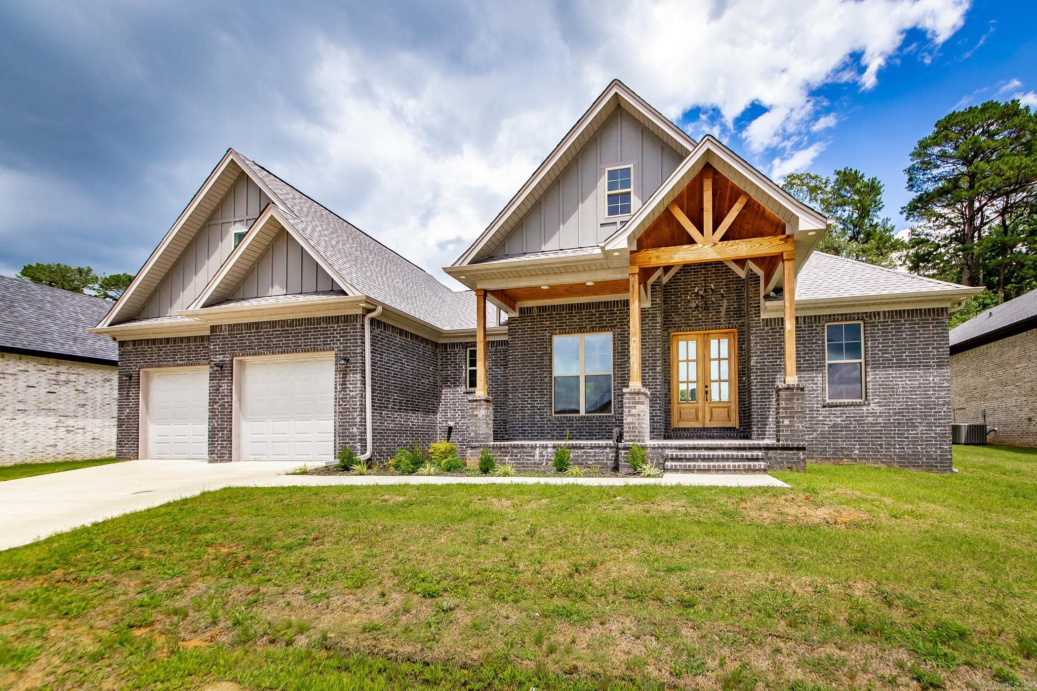 This beautifully designed home features 3 bedrooms plus a bonus room that could serve as a 4th bedroom, complete with its own ensuite bath. Soaring 10-foot ceilings run throughout and a dramatic vaulted ceiling in the main living area. The living room features a cozy fireplace and flows seamlessly into the spacious kitchen, which includes a large island with breakfast bar, a custom wood-accented vent hood, and a butler’s pantry that opens into a generous walk-in pantry. The primary suite includes a tray ceiling, luxurious tile shower, soaking tub, and a large walk-in closet with direct access to the laundry room. Step outside to a covered back patio overlooking the yard and backing up to peaceful green space—perfect for relaxing or entertaining. Home is packed with luxury touches—and ready for its first owners!