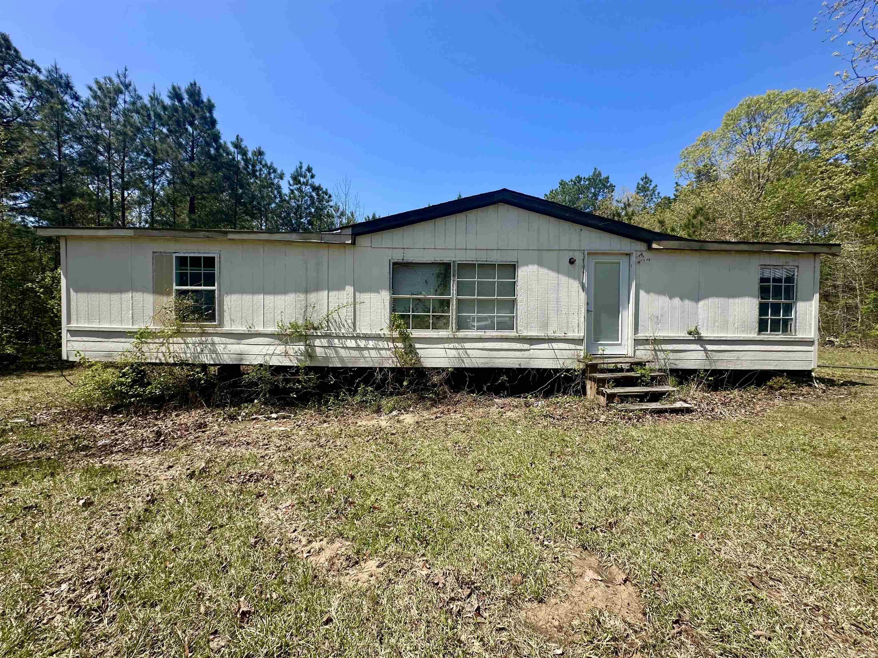 Investor Special!! Mobile home on 6.47 acres waiting for you to remodel and make it your own! This property is the perfect location sitting just outside city limits and providing lots of privacy. Let's schedule your showing today! Agents, see agent remarks.