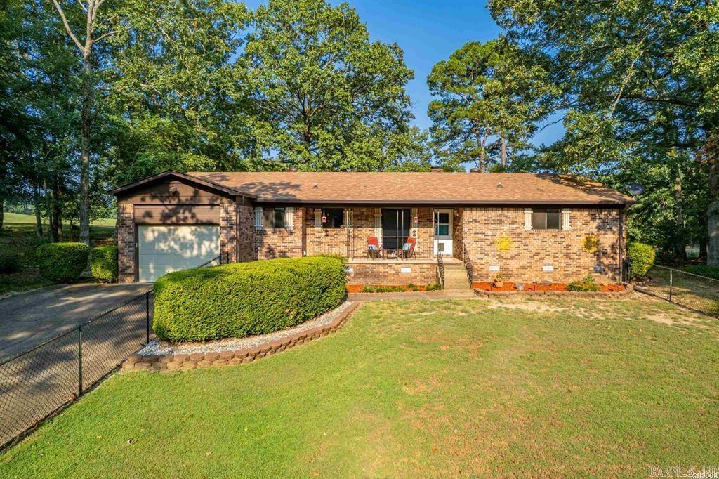 This home is situated on the 17th hole of the golf course in the desirable Diamondhead community. Featuring 2-bedroom, 2-bath, it offers comfort, privacy, and golf course views. Step inside to a warm and inviting living area featuring a cozy woodburning fireplace, perfect for relaxing evenings. The bright sunroom is ideal for enjoying morning coffee while overlooking the course. A one-car garage includes convenient back access for your golf cart or yard equipment. The large fenced front yard adds both charm and functionality, while the quiet neighborhood ensures a peaceful setting. This home is the perfect blend of golf course living and private retreat. Olympic Size Swimming Pool, Tennis & Basketball Courts, and Marina included in POA. Golf membership is separate from POA. This is an estate settlement, don't wait...this opportunity will not last long.