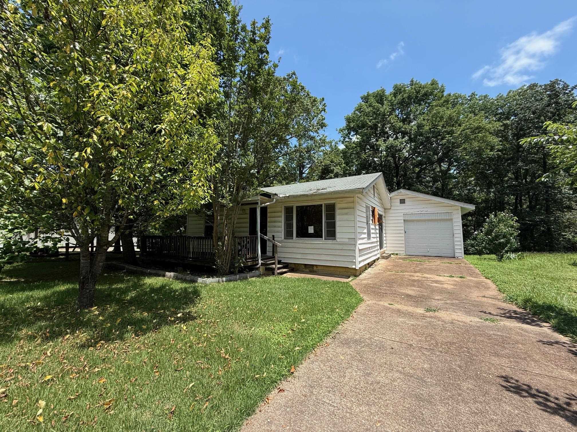 Priced at just $69,000, this 2-bedroom, 1.5-bath home offers 1,020 square feet of living space and sits on a 0.20-acre lot. Built in 1990 and located in town near the lake, the property features a few mature trees and a deck on the rear of the home—perfect for relaxing or entertaining. The home could use some updating but has strong potential. Whether you're looking for a fixer-upper, rental investment, or a place to personalize and make your own, this property is worth a look. Being sold as-is and ready for your ideas. Bring your vision and turn this into something special.