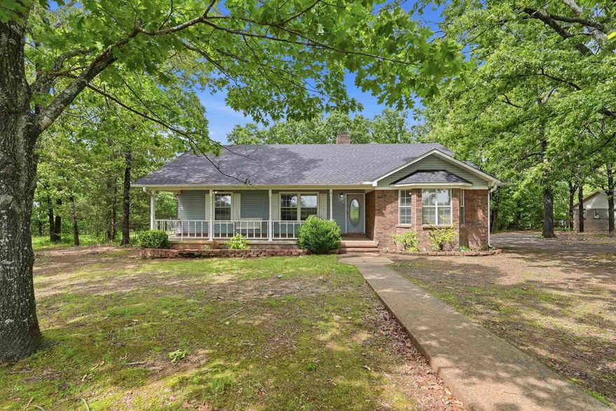 Spacious 4 bed, 2 bath home on 2 acres ideally located just minutes between Morrilton and Wonderview! This property offers a great mix of mature shade trees and a nicely cleared area, perfect for enjoying the outdoors. A small fenced section provides an area for kids and pets to play.  Inside, you’ll find several recent updates including a new roof (2024), HVAC system (2025), septic pumped (2026), fresh paint, updated flooring in the bedrooms, and new kitchen lighting. The basement has been thoughtfully converted into additional living space and is considered the 4th bedroom, with new carpet added to the stairs for a fresh finish.  Additional features include a cozy wood-burning stove fireplace, a newer storage building, and a metal carport for extra parking. Enjoy peaceful country living with convenient access to town!