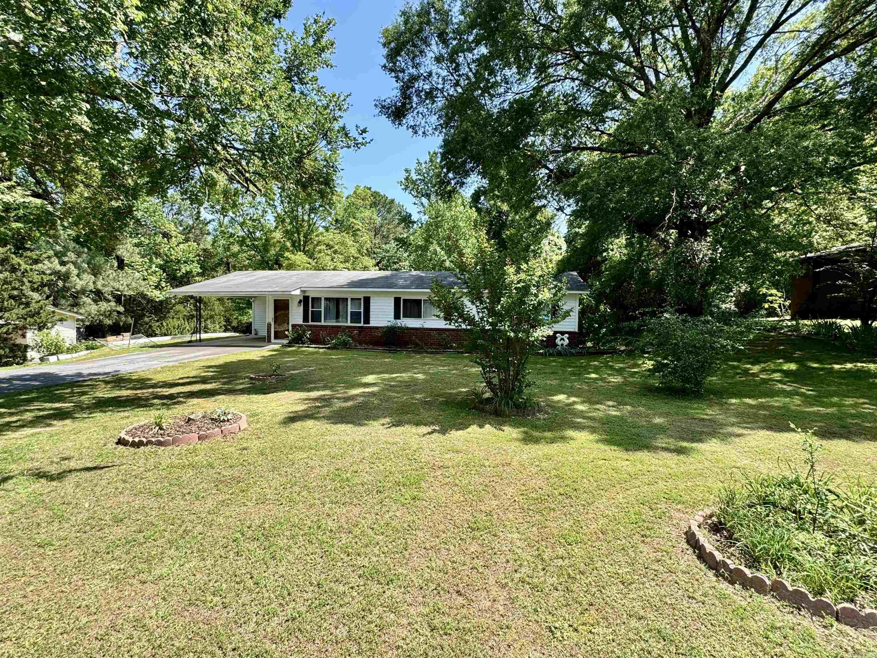 This home was owned and lived in by the same owner since new. It was well loved and maintained. Spacious living room. Full bath has been converted to walk in shower. Maintenance free exterior. Roof is approximately 5 years old. Covered carport. Extra landscaping. Kitchen has had updates including flooring. A few updates will make this home adorable. Refrigerator, washer and dryer stay. Newer water heater and HVAC. No seller property disclosure. Offers will require probate court approval.