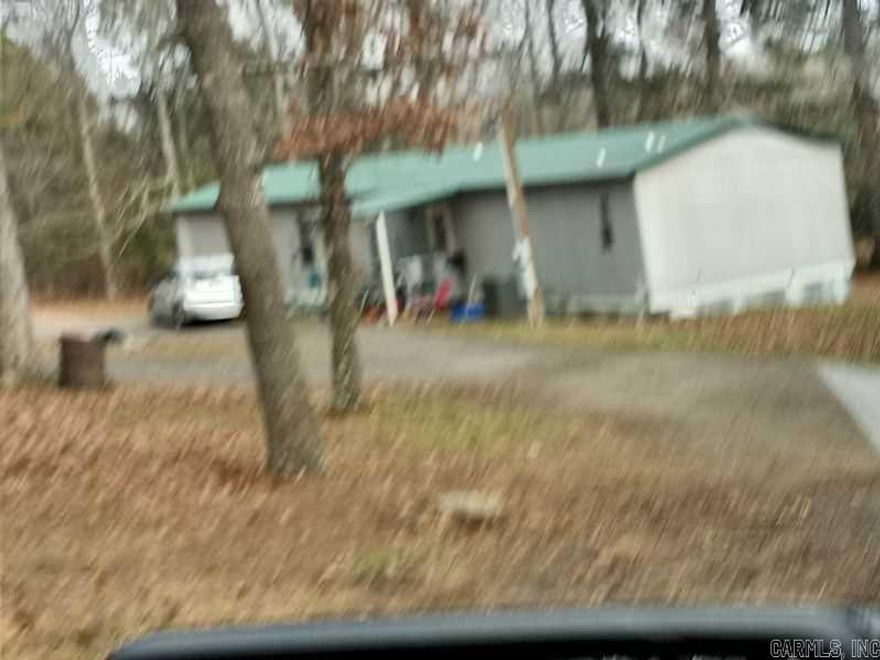 SOLD AS IS  2 BEDROOM 2 BATH MANUFACTURED HOME ON 2.02 ACRES. HVAC UNIT 3 YEARS OLD, DISHWASHER 1 YEAR OLD, REFRIGERATOR 1 YEAR OLD. TLC NEEDED. STORAGE BUILDING AND A DETACHED GARAGE. THIS MOBILE HOME IS NOT ON A PERMANENT FOUNDATION.