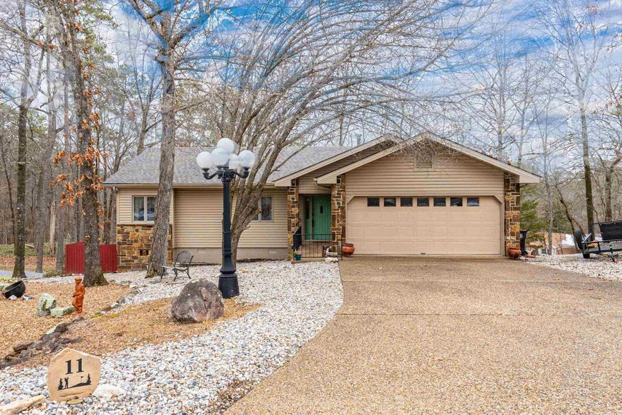 Perfectly positioned within walking distance to DeSoto Beach, scenic hiking trails, and the dog park, this well-maintained home offers the ideal blend of Hot Springs Village lifestyle and thoughtful updates. Enjoy easy access to outdoor recreation while coming home to a property that’s been carefully improved over the years. Recent upgrades include a new roof (2025), updated flooring (2023), and a fully encapsulated lower level for peace of mind. The interior feels fresh with walls and ceilings repainted, with no carpet and no popcorn, outdoor paint (2025), and a freshly repainted deck (2025)—perfect for relaxing after a day at the trails or beach. The hot tub is perched on its own deck and ready for you to enjoy! Additional highlights include a wifi enabled garage door opener with camera and a newer HVAC system, rounding out a home that’s truly move-in ready. You’ll love the semi circle driveway with plenty of parking. This is a rare opportunity to own a home where location, updates, and lifestyle come together