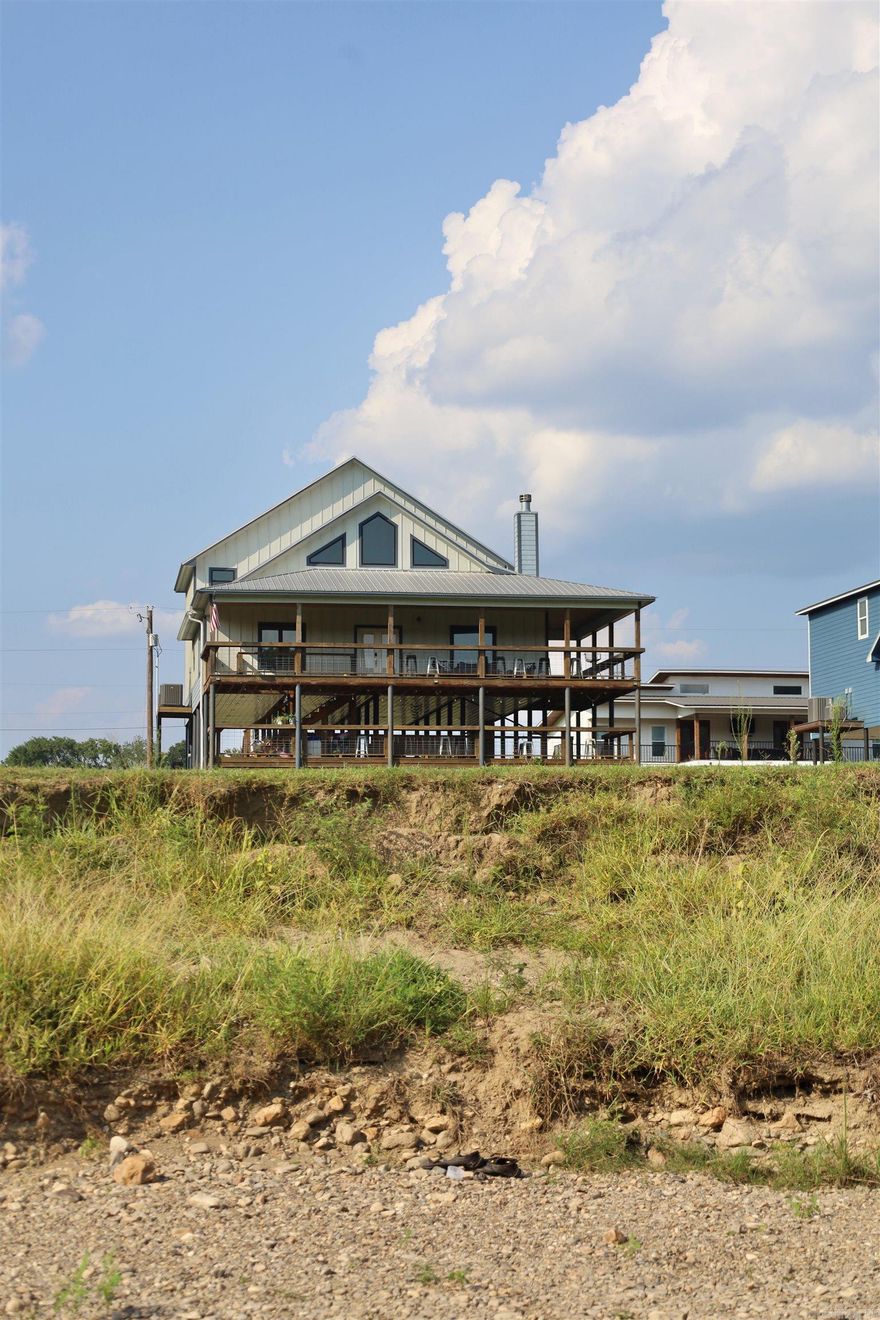 Welcome to the Dream Weaver Cabin – a beautifully furnished riverfront retreat with everything you need for a memorable stay. Located along a scenic stretch of river, this spacious cabin comfortably sleeps up to 12 guests, offering flexibility for a variety of stays.  Inside, you'll find an inviting great room with an open loft and a striking fireplace—ideal for gathering or relaxing. Step outside to take in the stunning river views, enjoy direct water access for tubing, kayaking, or fishing, and make use of the RV pad with full hookups for additional accommodations.  Just minutes from the Glenwood Golf Course and surrounded by outdoor recreation, this property offers year-round enjoyment. Whether you're seeking a getaway or a cabin with a strong rental history, the Dream Weaver Cabin stands out as a true gem on the river.