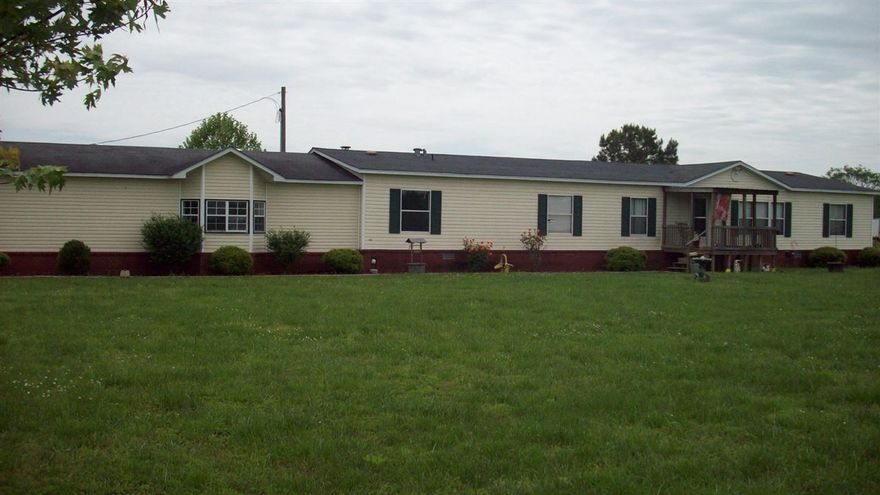 If you like a country setting with an above ground swimming pool, this is it.  4 bedroom, 2.5 bath manufactured home on 3 acres.  Includes extras like built ins, ceramic tile in foyer, huge master walk in closet, double sinks in master bath, jacuzzi tub, formal dining area, breakfast nook with a kitchen island, 2 skylights in the kitchen, large walk-in pantry, surround sound in the master bedroom and much more. Come by and check it out.
