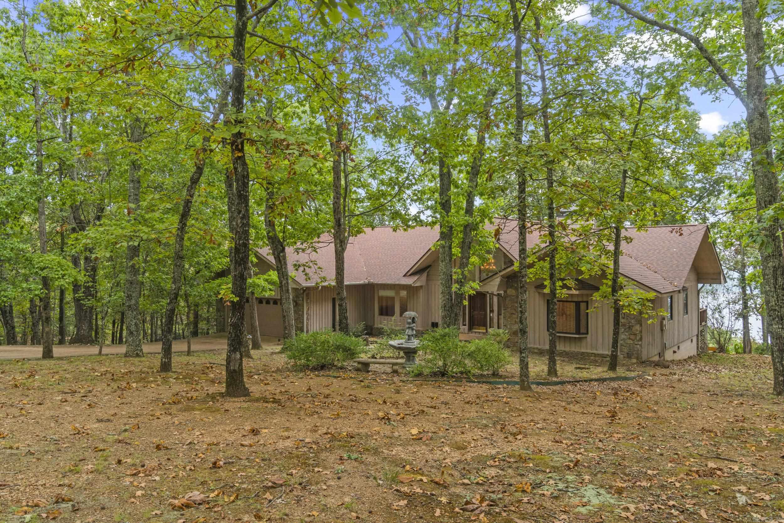 New to the market, you will love this charming home in Diamond Bluff nestled in the woods with breathtaking views of Greers Ferry Lake!! The floor plan encompasses 3 roomy bedrooms, 3 bathrooms giving you 2,582sf of spacious elegance! The generously proportioned interior flows effortlessly from the open-plan living space to the private screened in porch and rear deck perfect for family gatherings! All of this situated in a convenient, friendly neighborhood. Nature and tranquility are calling your name, schedule a private tour today to see this lovely property!