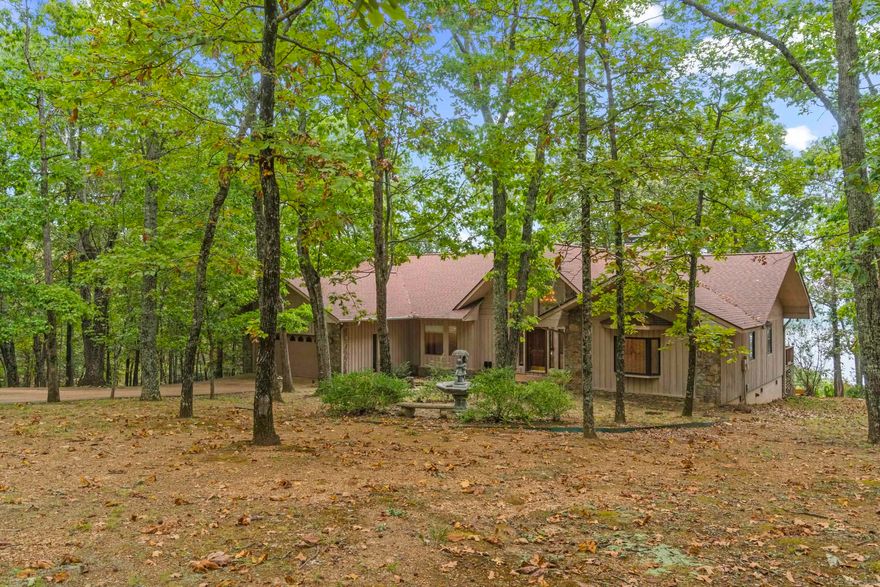 New to the market, you will love this charming home in Diamond Bluff nestled in the woods with breathtaking views of Greers Ferry Lake!! The floor plan encompasses 3 roomy bedrooms, 3 bathrooms giving you 2,582sf of spacious elegance! The generously proportioned interior flows effortlessly from the open-plan living space to the private screened in porch and rear deck perfect for family gatherings! All of this situated in a convenient, friendly neighborhood. Nature and tranquility are calling your name, schedule a private tour today to see this lovely property!