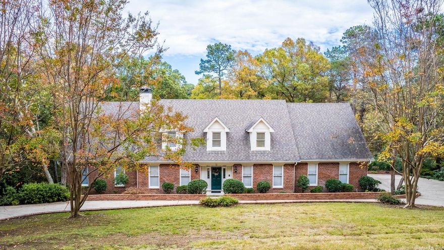 Gorgeous home in Pleasant Valley's Carmel Addition. Conveniently located in West Little Rock, this area offers private roads and a security gate with a low annual fee. Enjoy the wonderful view from the covered back deck overlooking a pretty back yard full of beautiful trees. The Primary Suite is on the main level. Three additional bedrooms and two full baths along with a nice size Bonus Room are on the upstairs level. The circular driveway at the front is double wide which allows for parked vehicles as well as access to and from the property.  The Great Room is spacious and has a wood burning fireplace with gas logs. Wonderful windows highlight the pretty view along the back of the home. The interior was painted in 2021. A new high efficiency heating and air system was installed downstairs and upstairs. A whole home generator was installed. A mini split was installed in the Primary Bedroom. All rooms are a good size. Excellent storage. Quality property. 9 Foot ceilings on main level. This is a terrific home in a beautiful area on a .85 acre lot.