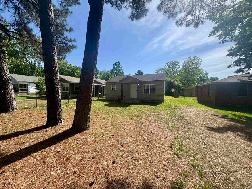 SELLERS OFFERING $5000 BUYERS CREDIT AND NEW ROOF!! Welcome to this charming and updated home nestled on a spacious lot in Jacksonville! From the moment you arrive, you’ll love the mature trees that provide shade, character, and curb appeal.  Step inside to find fresh updates throughout, including luxury vinyl flooring, neutral paint tones, and a bright, inviting layout. The living area offers a comfortable space to relax or entertain, while the kitchen features ample cabinet storage, functional layout, and included appliances—making it truly move-in ready.  The home offers cozy bedrooms filled with natural light, along with a clean and updated bathroom designed for everyday convenience. A dedicated laundry space adds extra functionality and storage.  Outside, enjoy a large yard with room to expand, entertain, or create your own outdoor retreat. Whether you’re a first-time homebuyer, downsizing, or looking for an investment opportunity, this property checks all the boxes.  Conveniently located near local schools, shopping, and quick access to Little Rock Air Force Base.