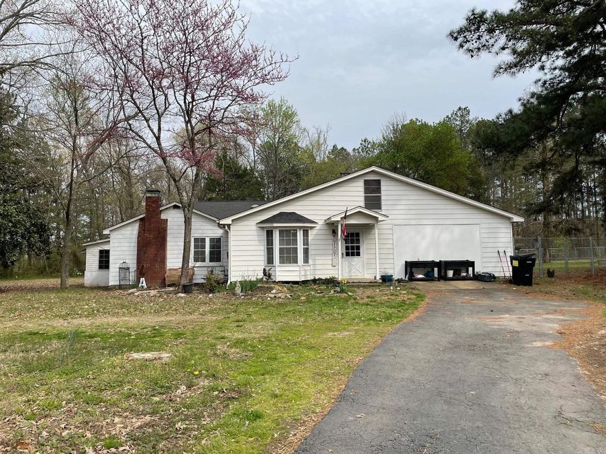4 bedroom 2 1/2 bath older home setting on a beautiful 9.25 acres on Highway 321 just right outside the city limits of Cabot. The home has had a few updates with two fireplaces and several outbuildings/sheds. The 4th bedroom can be a great office space. Beautiful pecan and magnolia trees. Plenty of room for livestock or another home on the property. Lots of possibilities!