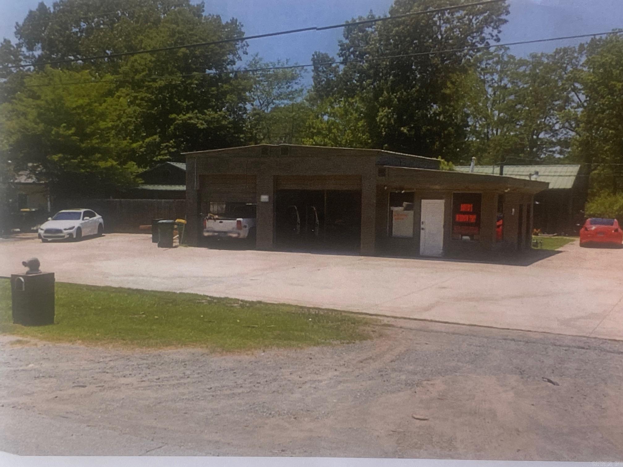 Garage Tenant and two residential units. Call listing agent for appointment only!