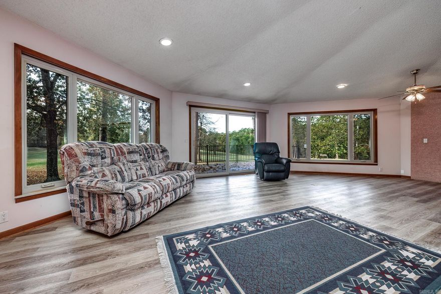 Great DeSoto Golf Course home with one of the best views on the course and golf front lot next door conveys with sale. Flat driveway and double garage. All brick home and composite deck. Roof is 4 years old, water heater replaced in 2022. Kitchen and garage refrigerators stay. Washer and dryer stay. Walk in showers in both baths. Double closets in master bedroom. Unique living room design with a wall of windows to enjoy the view. Wood burning fireplace. Pull out pantry in kitchen for large amount of storage space.