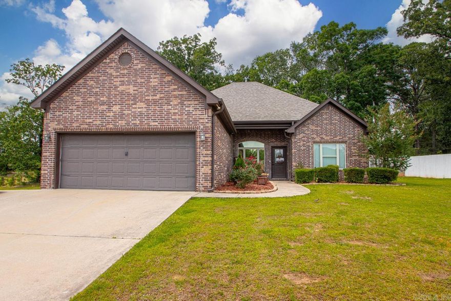 Welcome to this gorgeous home located in Crossroads Village! Only minutes to Hwy 70 & I-30 and convenient to Benton, Hot Springs & Little Rock! From the moment you enter, the 13 foot ceilings draw you in, offering open-concept living and a special cozy atmosphere! The living room is large and open to the dining and kitchen! The kitchen features stainless steel appliances and granite countertops! The master is separate from the 2 additional bedrooms and features a beautiful trey ceiling and large windows, flooding the room with natural light! The master bath with double vanity and separate tub and shower flows directly into the roomy master closet! The guest bedrooms are opposite side of the home and are both large with great closet space! The large, covered back porch is the perfect spot for grilling and entertaining! The fenced in back yard is huge and offers the ability to expand into the almost 1 acre lot! Don't miss your opportunity to own this gorgeous home in a fantastic location! Schedule your private tour today!