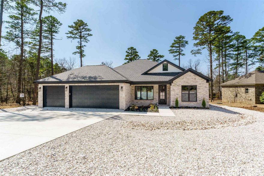 This 3 Bed, 2 bath home offers the perfect blend of style and function. The open floor plan is ideal for entertaining with a seamless flow between kitchen, dining and living areas. Theres a cozy fireplace too! A wall of windows brings in Natural light while offering beautiful neighborhood views. Storage won't be an issue here, as the home is packed with walk-in closets pantry space and more! The much coveted 3 CAR GARAGE provides even more room for your vehicles, golf cart or a workshop setup. There's a low maintenance yard and a lovely flower bed in front. Enjoy the best of Hot Springs Village living with golf, lake and trails just minutes away.
