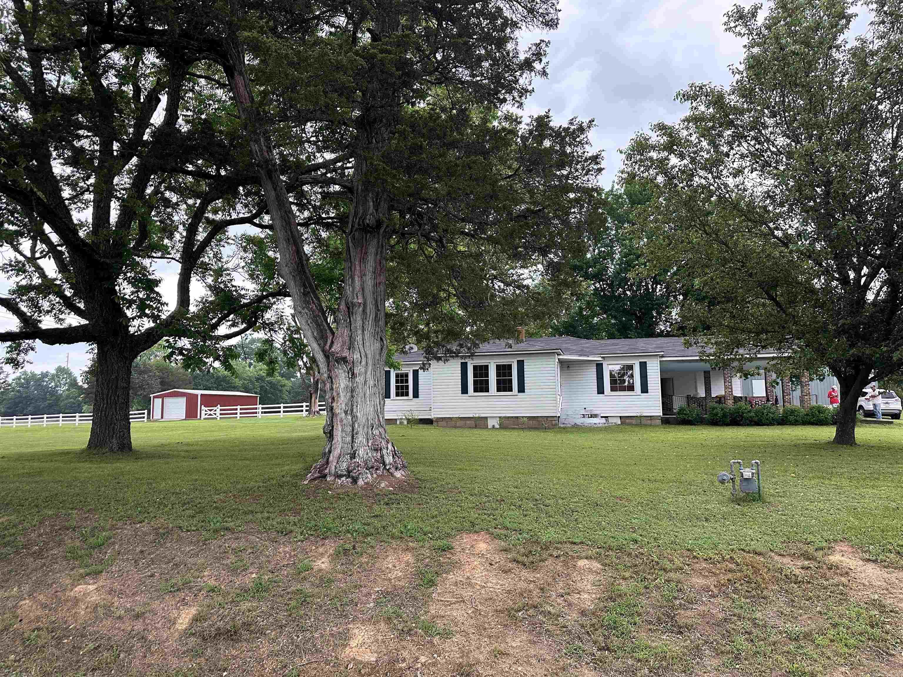 Cozy Country Home with Spacious Workshop and Relaxing Hot Tub. This delightful 4-bedroom, 2-bathroom country home is ready for its new owners. Enjoy the large yard, a 60x80 shop with electricity, a storm shelter, and a hot tub perfect for unwinding in the evenings. Experience country living at its finest!