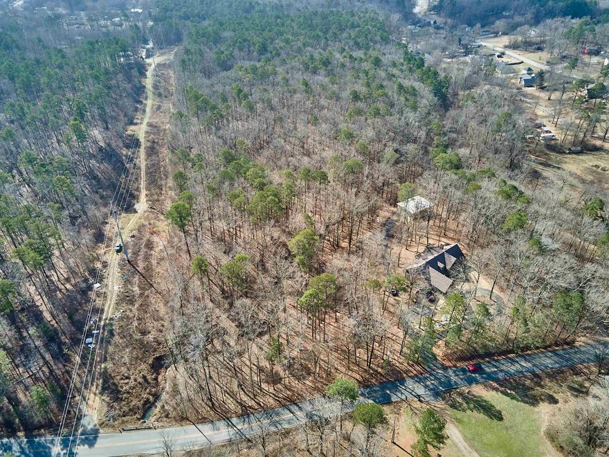 Beautiful land to develop into a wonderful subdivision. Rolling hills, beautiful creek runs through the property. Land is broken into separate parcels property could make a beautiful oasis for your home. Located close to town!!!