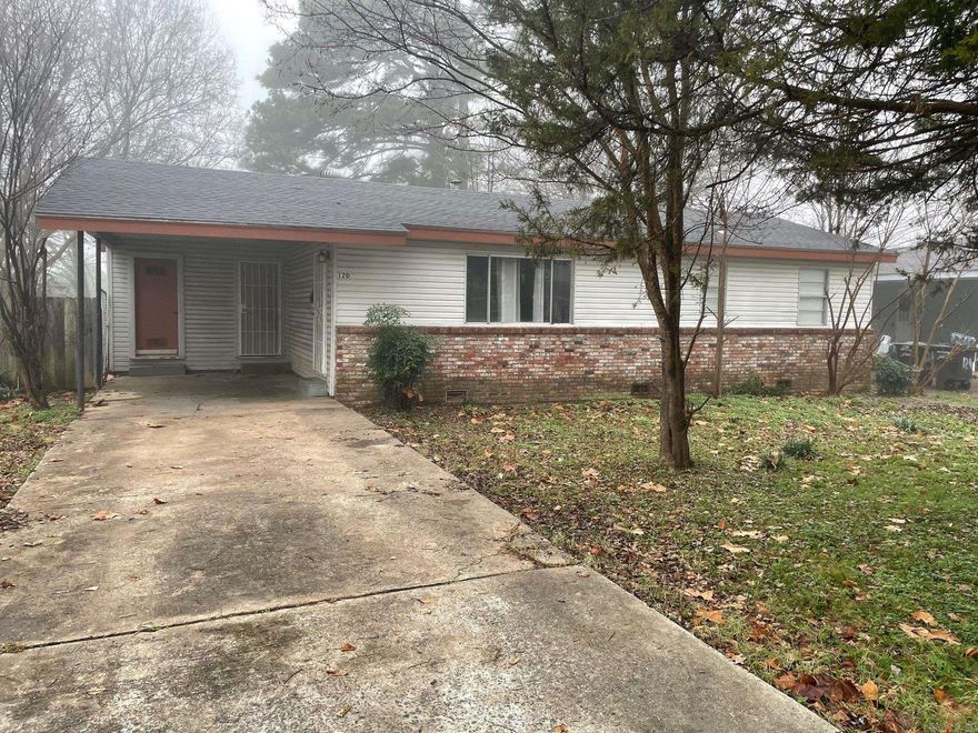 Quiet Neighborhood Home with vinyl siding on exterior. Nice corner lot with large fenced in back yard. Laundry room with appliance hook ups is just off of kitchen.