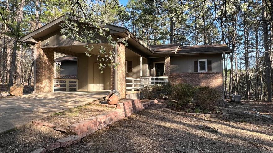 Must see this adorable 2 bedroom, 2 bath cottage style home. Perfectly located at the end of a cul-de-sac. It is private but not remote and located close to amenities. Enjoy the peaceful ambiance watching the deer from the AR room.   With the added benefit of a deck to entertain.  Split bedroom floorplan with a living/dining combo.  New roof.  HVAC is 4 years old.   Accordion shades thru out the home.  Storage in the carport and storage cabinet in the back.  Low maintenance landscaping.  Refrigerator, washer and dryer to convey.  New property owners have a $2,000.00 new member buy in fee due at closing.