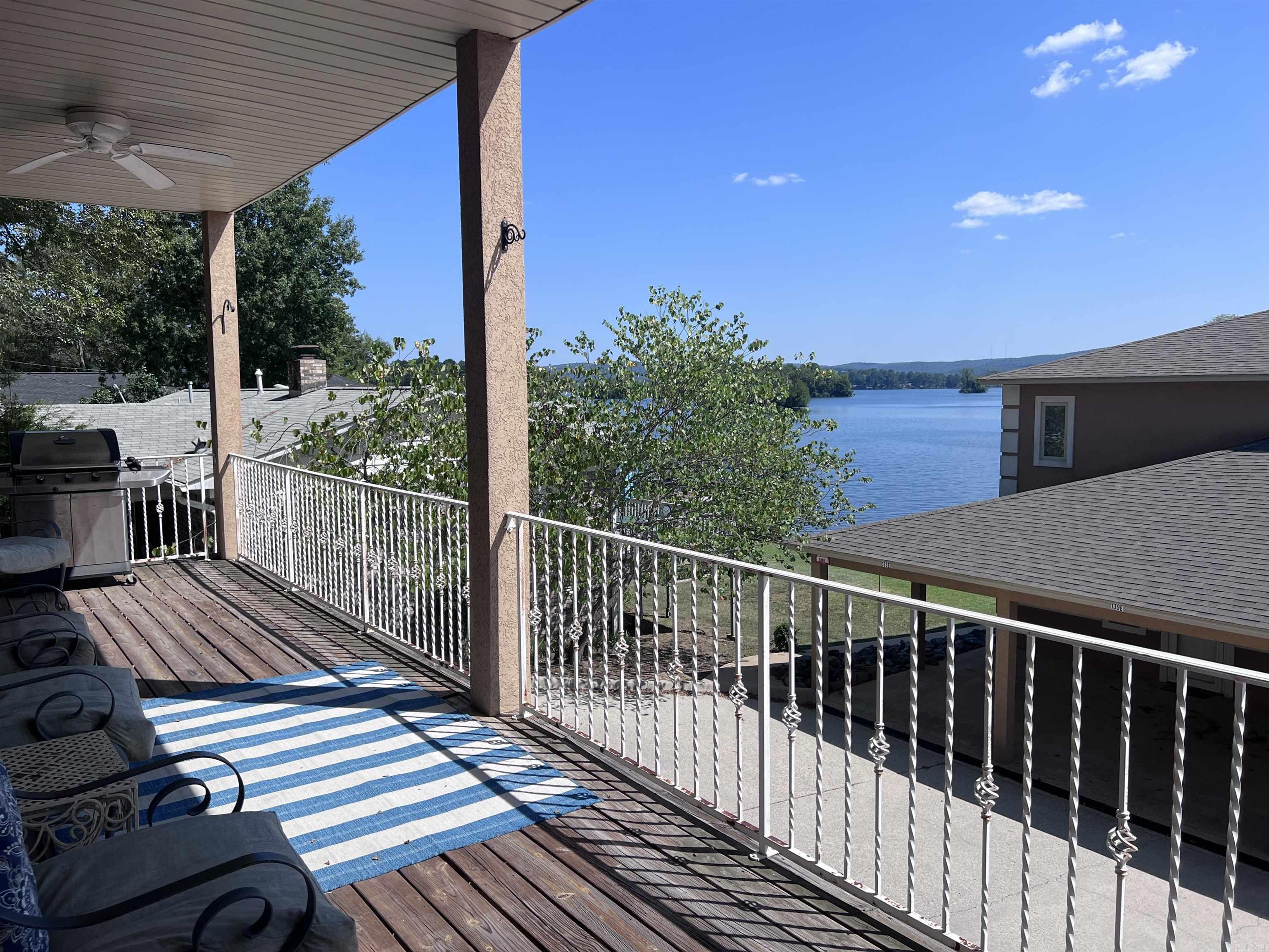 Welcome to 137 Central Terrace, Unit C, a beautiful lakefront condo on Lake Hamilton in Hot Springs, AR. This spacious 2-bedroom, 2-bathroom home offers 1,542 sq ft of comfortable living space. Step outside to your private deck and take in the breathtaking views of the lake—an ideal spot for relaxing or enjoying outdoor meals. Inside, a gas log fireplace creates a cozy atmosphere, perfect for unwinding. With the lake just steps away, enjoy all the recreational activities it offers, from boating and fishing to swimming and jet skiing. Covered parking keeps your vehicle protected, and the convenient location puts you close to local dining, shopping, and entertainment.