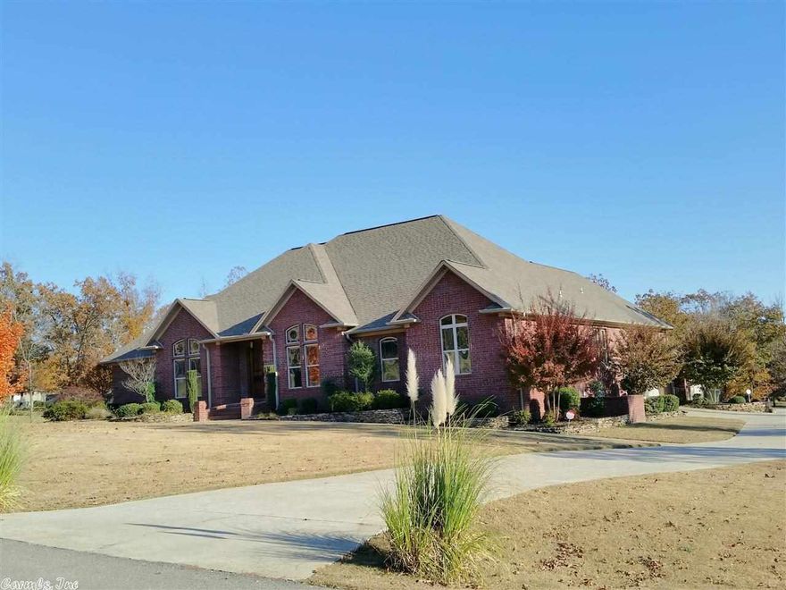 Fabulous home with all the extras...18'x36' salt water pool, wrought iron fencing, cypress covered 2 level deck/patio w/tv connection/sound speakers, fire pit & life time warrantied deck flooring, Detached 2 car garage/shop + 2 car attached garage, outside lighting, beautiful landscaping. Inside features Viking 6 burner gas, double ovens, granite countertops, impressive island, hardwood floors and upscale lighting. HUGE laundry room, security system, lots of storage & stained glass windows & tall ceilings..