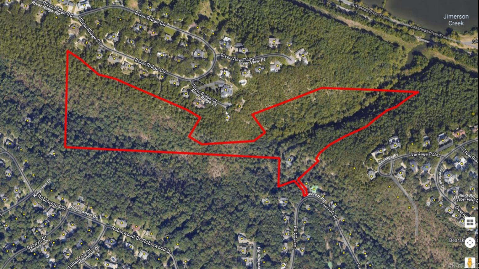 Discover a hidden sanctuary in the heart of Little Rock! This extraordinary property, totalling 31.06 acres in Foxcroft per tax assessor, offers a unique blend of natural beauty and development opportunity. The land itself is a treasure, with 95% covered in diverse, mature trees and offering stunning bluff views overlooking the Arkansas River. Enjoy peace and quiet, shielded from the city noise by the natural terrain. The serence Jimerson Creek flows year round through the property. This propery holds incredible potential for developement for numerous configurations for the creation of a private gated community or a stunning private estate. Conveniently located close to everything Little Rock has to offer. Enjoy easy access to the River Trail connecting you to Two Rivers Park and The Big Dam Bridge. Located minutes from dining, shopping and a short drive to major hospital and downtown Little Rock. Experience the tranquility of nature and the convenience of city living in one exceptional location. Don't miss this once in a life-time opportunity to create your dream estate or develop a one-of-a-kind community. Also included is a 2400 sqft house on property.