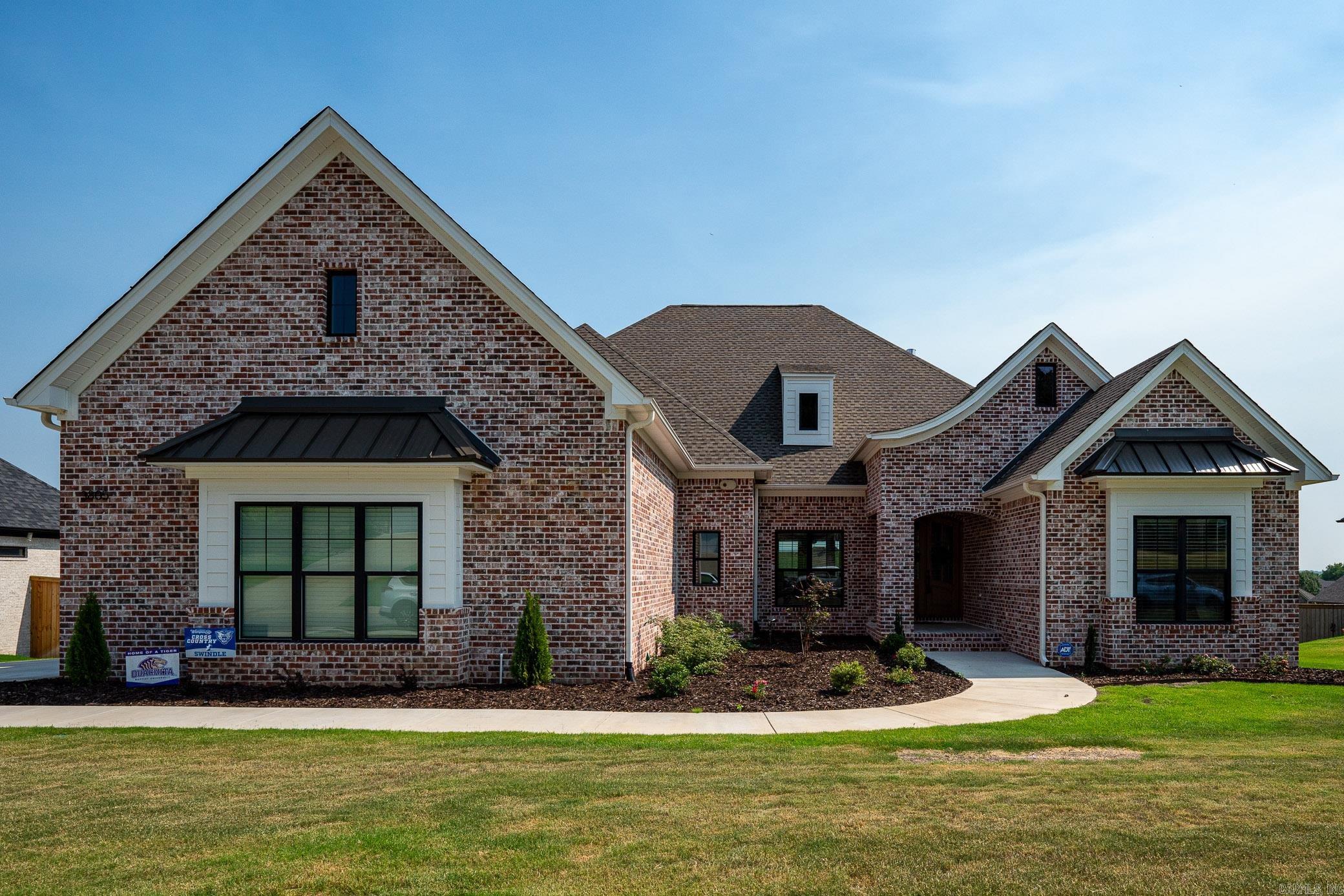 Unbelievable character in this almost new home in beautiful Weatherstone Sub. Z-line range/oven, 6 burner gas cooktop, electric dbl ovens, other appliances are KitchenAid, Quartz countertops, custom cabinets. Brick arch from living area to kitchen, walk-in pantry. Extensive trim work. Wood floors except carpet in bonus room and tile in wet areas. Custom tiled shower in primary bath. Bonus room and office on 2nd floor. 4BR, 3.5 BA, FDR, open concept in living area. Covered rear porch. Metal accents to roof over porch and front bedroom. Sprinkler system, French drains. 3 car sideload garage. Lg laundry room with storage and sink. Jack-n-Jill bath connecting 2 front bedrooms. *SEE REMARKS*