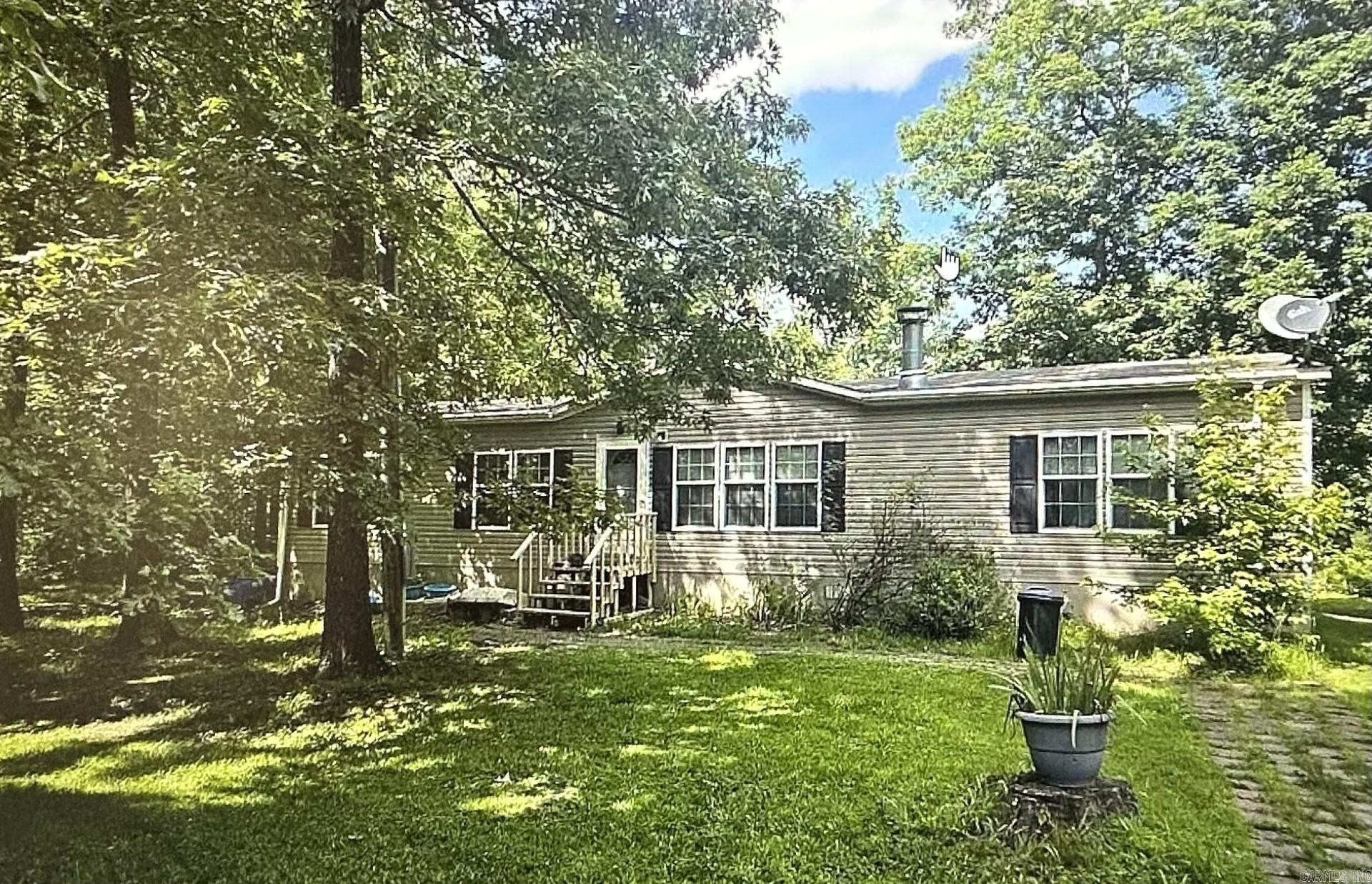 This spacious home features an open floor plan where the living room flows into the kitchen and dining area, with a convenient laundry room tucked into the back corner. The primary suite sits just off the entry, while three additional bedrooms and a guest bath extend to the other side of the home, each offering large closets for plenty of storage. Outside, the acreage provides room to spread out and enjoy country living. Horses and chickens have been kept here before, making it a great option for those looking for space for animals, gardens, or simply the peace and privacy of wide-open land. With its flexible layout and nearly 10 acres to enjoy, this property is ready for its next chapter.