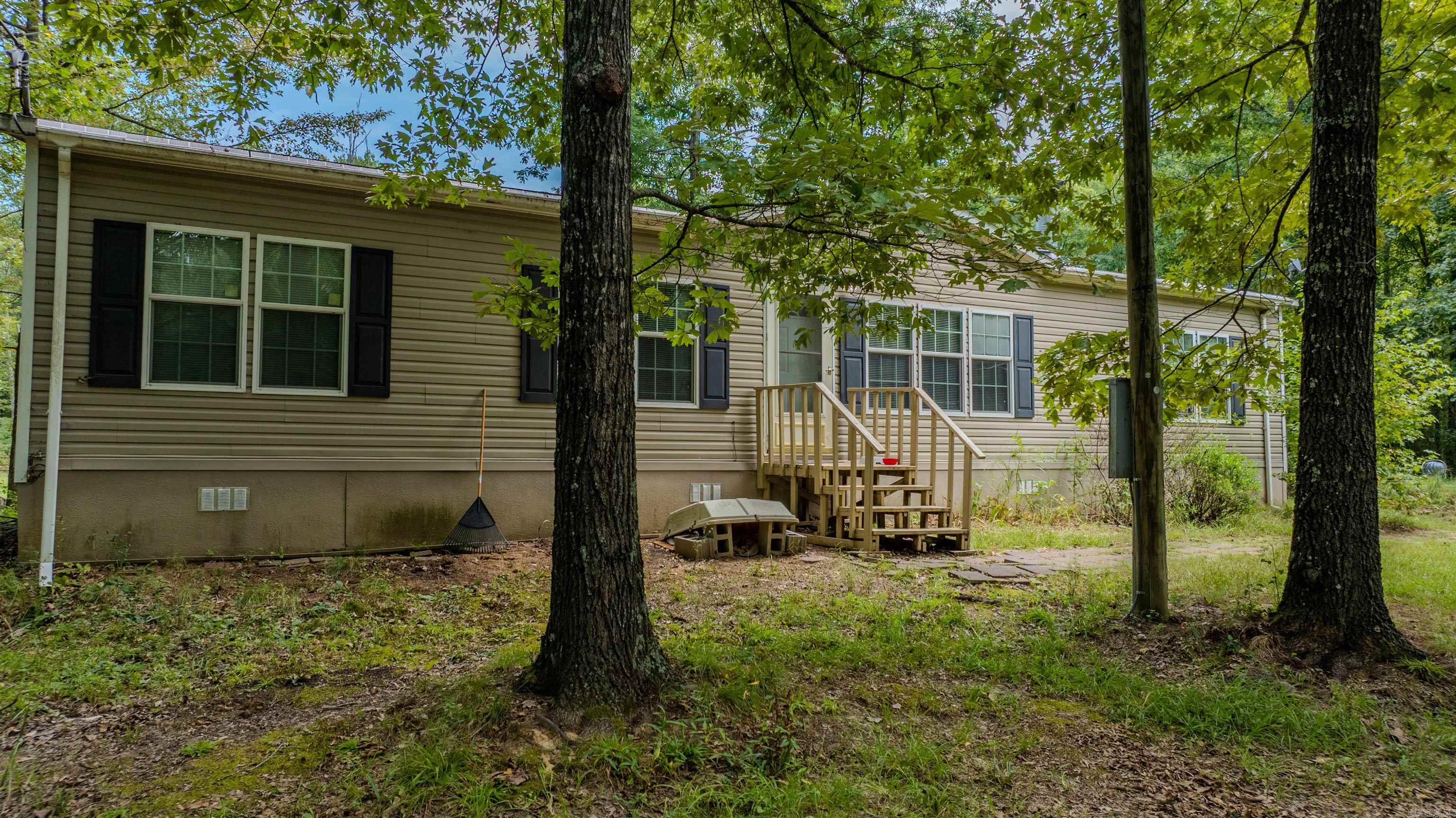 This spacious home features an open floor plan where the living room flows into the kitchen and dining area, with a convenient laundry room tucked into the back corner. The primary suite sits just off the entry, while three additional bedrooms and a guest bath extend to the other side of the home, each offering large closets for plenty of storage. Outside, the acreage provides room to spread out and enjoy country living. Horses and chickens have been kept here before, making it a great option for those looking for space for animals, gardens, or simply the peace and privacy of wide-open land. With its flexible layout and nearly 10 acres to enjoy, this property is ready for its next chapter.