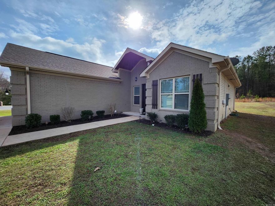 Glistening like a freshly minted coin! This 4-bedroom, 2-bathroom home, constructed in 2017, features an expansive and well-designed floorplan. Situated on 0.37 acres, it's completely tailored to perfection! With soaring ceilings throughout, tray ceilings in the living area and master bedroom adorned with recessed lighting, and elaborate crown molding, every detail exudes elegance. Granite countertops and under-mount sinks grace all bathrooms, while natural light floods the space. Ample closets with built-in storage enhance the bedrooms, complemented by a luxurious soaking tub in the main bath and a Jacuzzi in the master, alongside a separate stone shower. Other highlights include 2" faux wood blinds, wood flooring, newly carpeted secondary bedrooms, travertine floors in the kitchen and baths, and stainless steel Whirlpool appliances, including a Samsung Twin Cooling Plus fridge with a pull freezer. The kitchen boasts a bar with pendant lighting, and the garage shines with a freshly painted interior and custom epoxy floor. Step outside to the inviting patio, perfect for entertaining guests or enjoying a tranquil moment with your morning coffee!!  ***********AGENTS SEE REMARKS******
