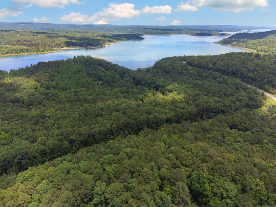 Beautiful wooded lot with lake access nearby. Trees could be cut and sold. Utilities at the road. Agents see remarks.