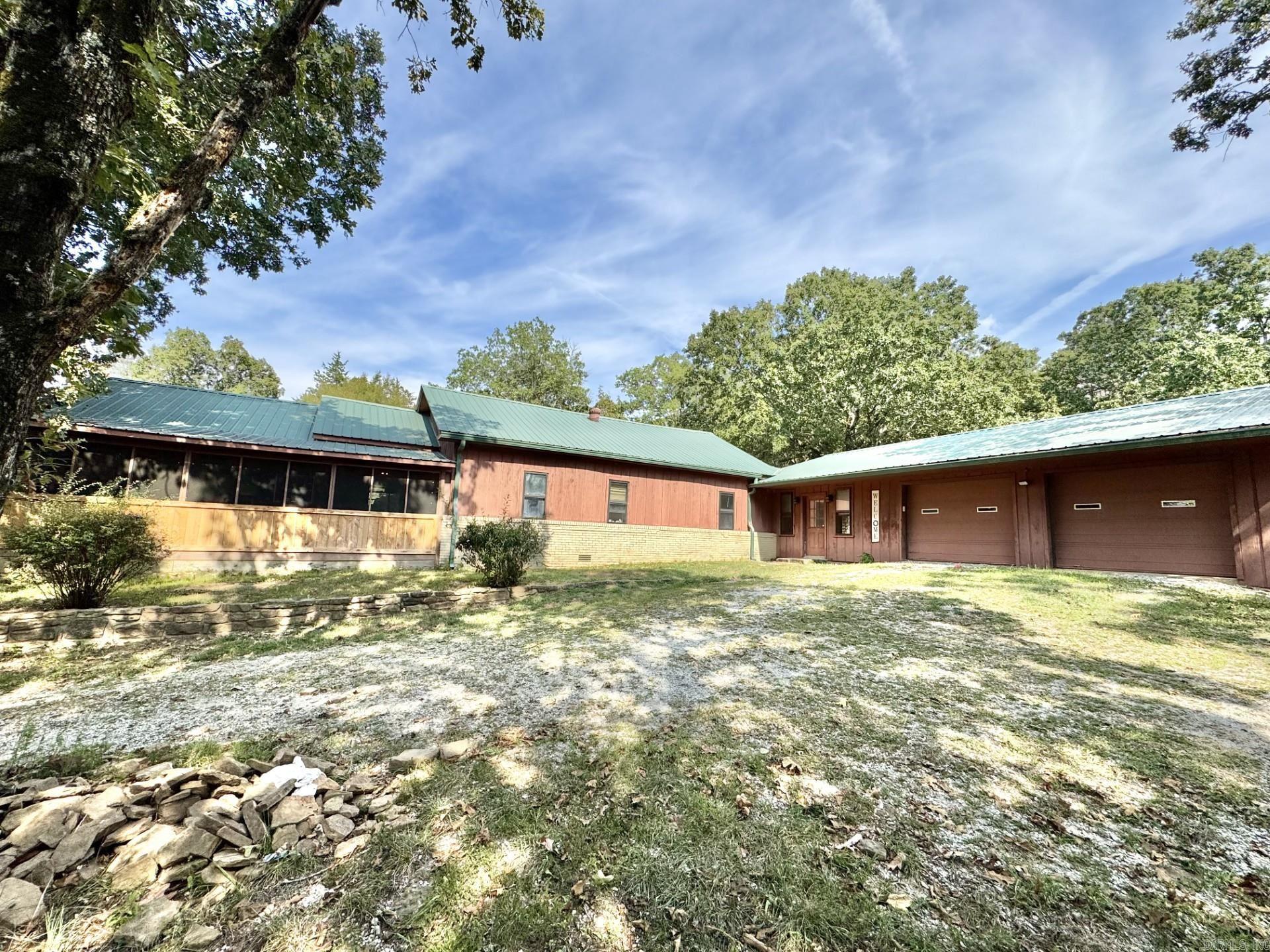 This wonderful property features 3 bedrooms, 2 bathrooms, a separate laundry room, an office space, screened in porch, a small barn, 3 chicken coops, a 2-car garage, a 20kW whole home Generac Generator, and so much more. The property is nestled in a serene country setting with 3.03 acres and privacy. There are no close neighbors, and no restrictions. Just a short drive away from the towns of Leslie and Mountain View. Which include local amenities and attractions such as restaurants, shopping, horseback riding, hiking trails, the White River, Blachard Springs Caverns, The Ozark Folk Center State Park and so much more. Call today to set up an appointment and come take a look at this fantastic property.