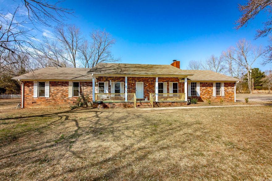 Welcome to the perfect blend of country charm and city convenience.  Situated on 3.96 acres, this spacious 2,316 square foot - 4 bedroom, 2 bath home with additional office space offers room to spread out, relax, and enjoy peaceful living - all just minutes from town.  The living area showcases a cozy fireplace, creating the perfect gathering space for family and friends. The flexible office space provides the perfect setup for working from home, hobbies, or a playroom.  Enjoy your morning coffee or unwind in the evening from your private master patio, while overlooking the peaceful surroundings.  New well water pump installed in 2025.  If you have been searching for space, privacy, and small-town charm without sacrificing convenience, this property delivers the best of both worlds.