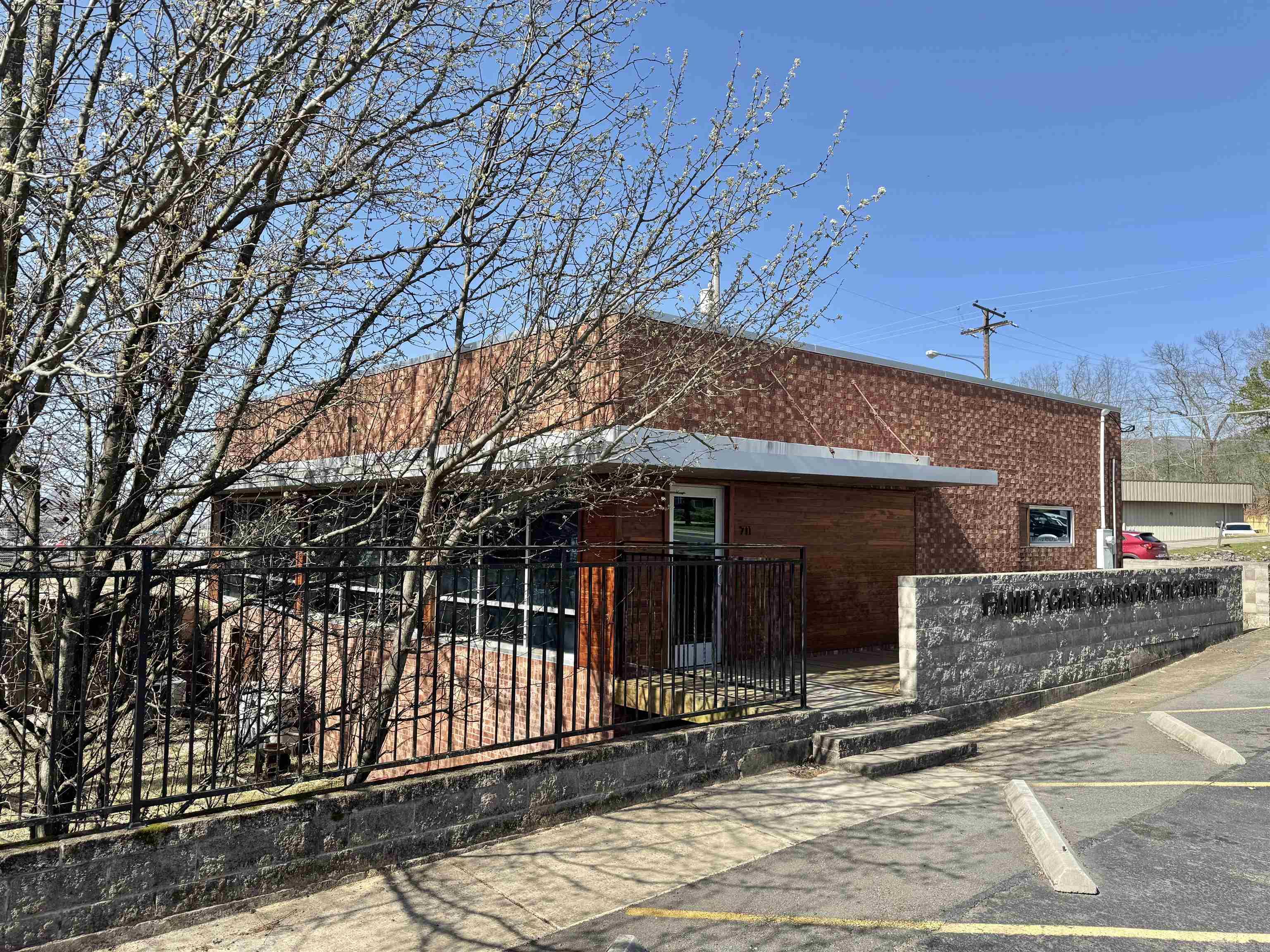 Well established Chiropractic Clinic in the heart of Hot Springs. High traffic visibility with over 23,000 car per day. Large lobby, bathroom, kitchen area, separate shower, 5 patient rooms, 12 parking spots and separate entry and exit. Basement extends throughout the entire building with a fully fenced yard for extra privacy.