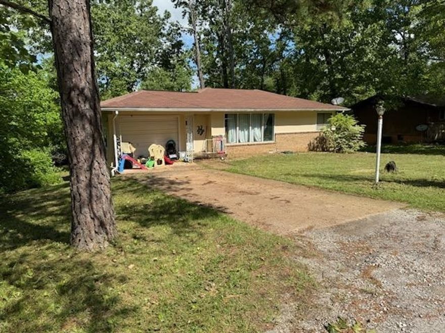 This house has been remodeled a few years ago.  New floors, 2 new bathrooms, new countertops in the kitchen, painted inside & out. Two bedrooms upstairs and the lower level has game room(18x14), utility room & bonus room that could be 3rd bedroom. Large deck and a patio downstairs. Stove and dishwasher are included. It has central heat and air and a one car garage. Close to town, the lakes and golf courses. Come and meet the people and enjoy the amenities and atmosphere of this small town.  Ride your golf cart or side by side to the lakes, town center and golf course. Come and see it today.
