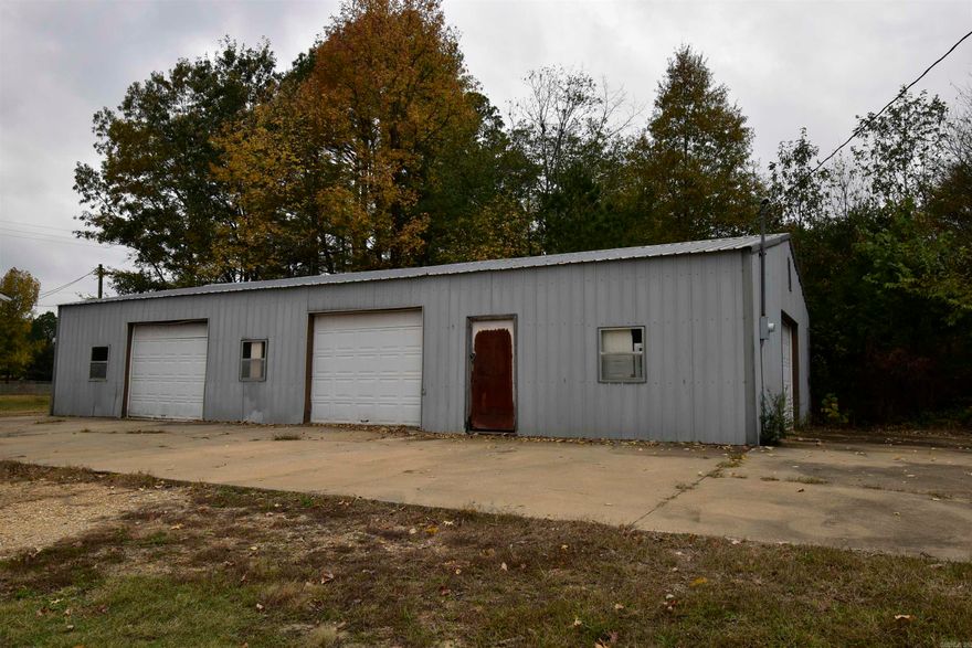 Seller's preference is to sell — but flexibility is on the table. With an acceptable offer, seller is open to: (1) pursuing rezoning to a residential classification — single-family or multi-family (2) negotiating a gross lease arrangement.  The property features three separate buildings totaling five work bays: a 32'x60' garage, a 36'x44' garage (both previously operated as mechanic shops with durable slab flooring), and a 24'x24' building with potential for a private office. Property is currently zoned HC/C-3. Current zoning opens the door to a wide range of uses — automotive, retail, flea market, coffee shop, and more. Whether you're launching a new venture, expanding an existing business, or exploring a residential development opportunity, this high-exposure corner delivers the space, access, and flexibility to make it happen.