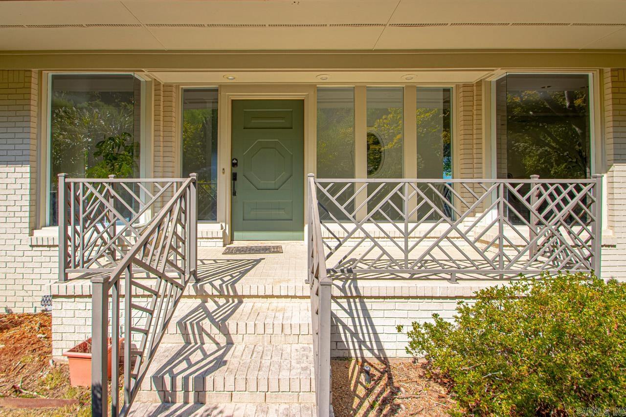 Located in the HIGHLY desirable River Ridge Manor, this home has panoramic views of the Arkansas River! This 3 bed/3.5 bath home is overflowing w/character and has fresh paint upstairs! Updates also include 2 NEW electric HVAC units upstairs, and 2 NEW electric water heaters!! These views are BREATHTAKING and the location is super convenient! Rare to find a lot with this view! Office, laundry, wet bar, 2 car garage, 3 living areas, master on main level. MUST SEE!!