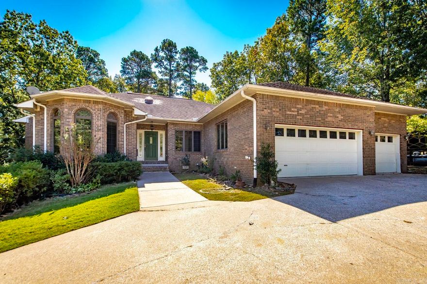 Golf-front brick beauty on a shaded double lot in Indian Hills. Tucked along the 10th green, this home delivers a true golf-course lifestyle with rare extra space, privacy, and timeless curb appeal. Set on a generous, tree-canopied double lot, the property offers cool afternoon shade, a quiet natural buffer, and plenty of room for outdoor living—garden, games, grilling, or future enhancements. Unwind on the screened-in porch with serene, year-round views of the green.  Inside, fresh luxury vinyl plank flooring runs throughout for a clean, cohesive look. The large kitchen provides ample prep space and storage, ideal for daily living or entertaining. A comfortable primary suite creates a private retreat, and the oversized 3-car garage handles vehicles and gear with ease. You will love the extra garage workshop, its perfect for a golf cart or ATV/UTV.  Fairfield Bay has so many outdoor activities to enjoy such as pickle ball, tennis, hiking, 80 miles of atv/utv trails, 2 golf courses and one of the cleanest lakes in the United States.  Enjoy effortless living where golf, lake days, dining, and recreation are just moments from your door. Schedule your showing today.
