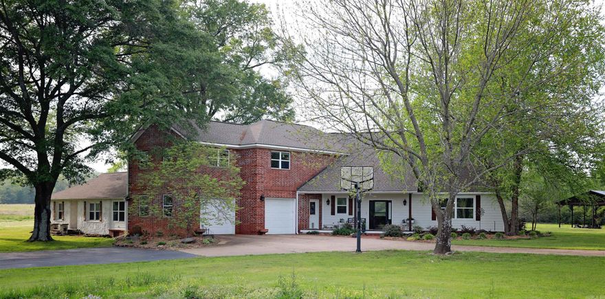 Are looking for the perfect place for your home, a wedding or event venue or an Airbnb with the charm of a flower farm, barn, pavilion, mother-in-law quarters and 11+/- acres for horses or cattle? Located only 8 minutes from downtown Searcy and 45 minutes from downtown Little Rock, this unique property has 5,400 sf in the main house (remodeled original rock house built in 1956 w/ 4,400 sf addition added in 2005.) 6 BR / 4½ BA. 27’ ceilings in living room. 8 ton, zoned Geo-thermal HVAC & Marathon water heaters. The second home has 1,600 sf, 2 BR / 2 BA guest house with a sunroom that could be third bedroom, 40 x 50 barn/shop with three overhead doors & 220 volt electricity and another building that could be an educational center or is currently used for the flower farm. Stately trees and two creeks are also part of this amazing paradise with income potential. Price has been reduced by removing 6 acres that are available to be purchased with the house. Serious buyers only, please.