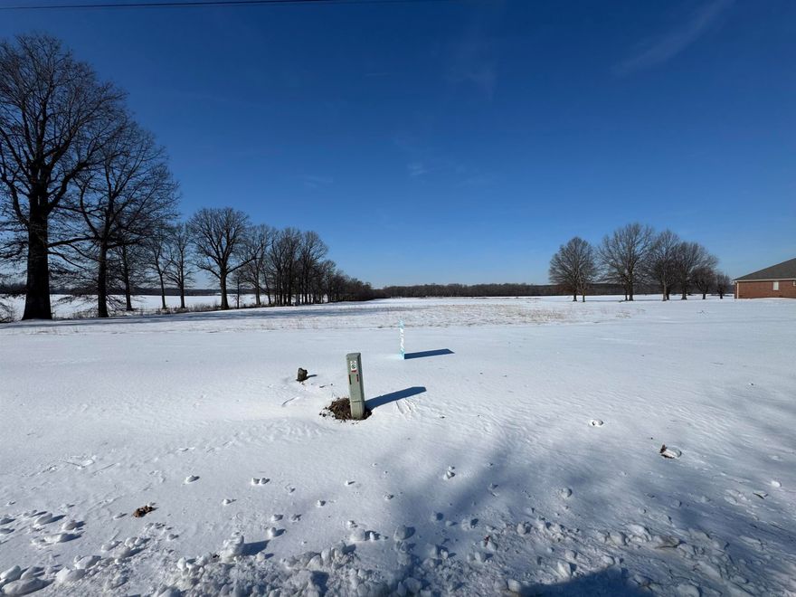 Looking for a beautiful spot to build a home, barndo, shop/house, whatever it is you are looking for this spot is ready for your vision. 1.84 acres newly surveyed, no restrictions, some utilities available and septic would be required  Paved road frontage 259.4x310