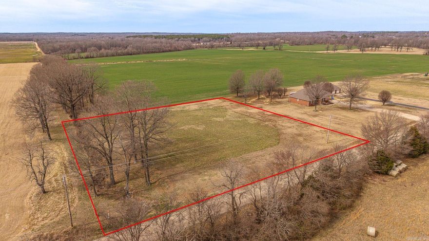 Looking for a beautiful spot to build a home, barndo, shop/house, whatever it is you are looking for this spot is ready for your vision. 1.84 acres newly surveyed, no restrictions, some utilities available and septic would be required  Paved road frontage 259.4x310