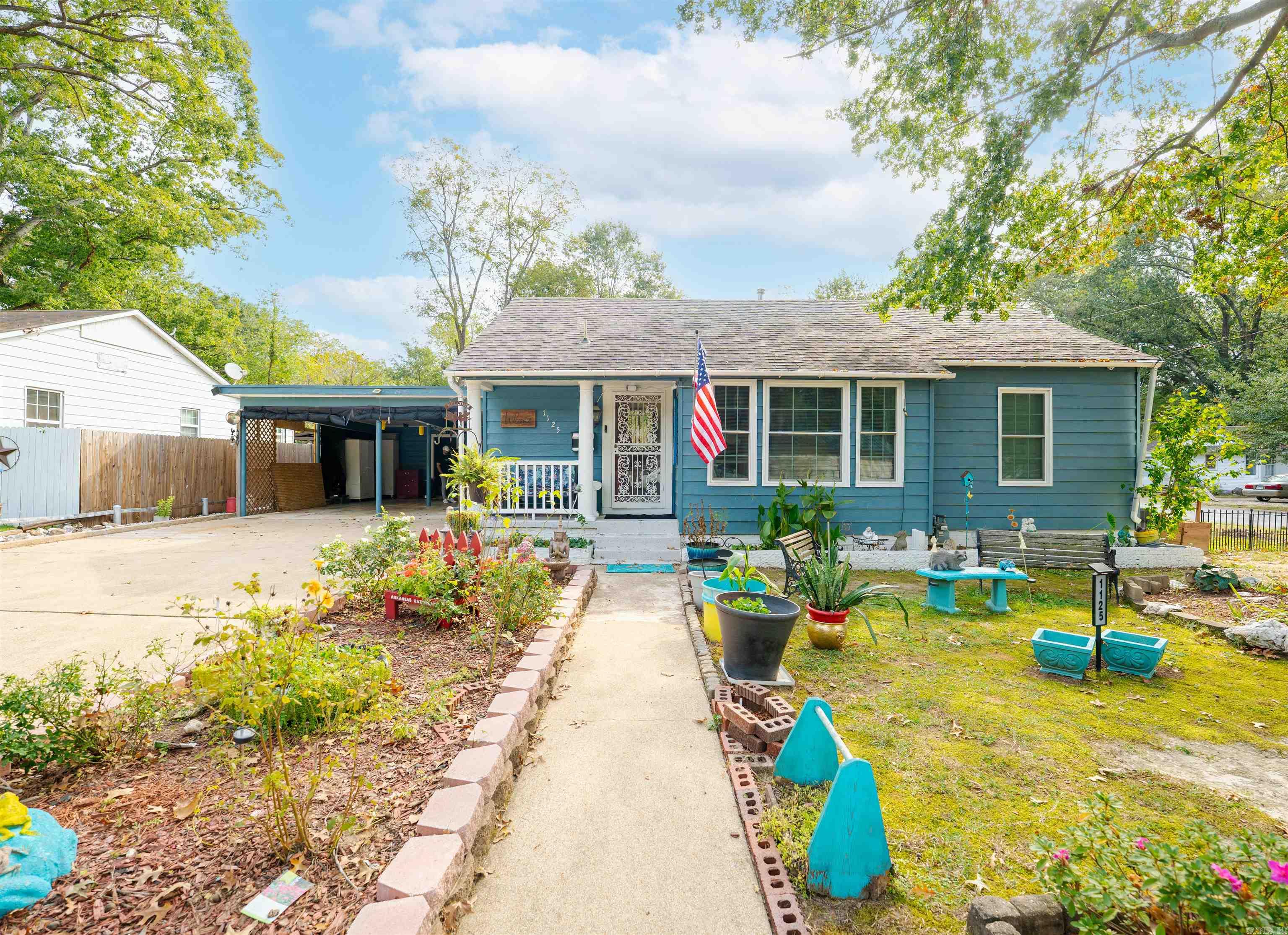 Im in Malvern, Arkansas, the Brick Captial of the world! We’re just a short drive from Hot Springs National Park, Lake Cathering State Park, and tons of Arkansas’ most beautiful hiking trails! This is an inviting home that offers 2 true bedrooms plus an additional space with a connected full bath that makes the perfect setup for a 3rd bedroom, guest suite, or home office—whatever fits your life best. From the entry, a cozy living area features a faux fireplace with a gas stove that brings both warmth and ambiance. The galley kitchen features new stone countertops and new flooring installed in 2024. The two secondary bedrooms have easy access to a shared bath. Step outside to a beautifully landscaped yard complete with a deck, fenced backyard, above-ground pool, and not one but two outbuildings—ideal for storage, hobbies, or your next creative project. Conveniently located near shopping, dining, and schools, this home balances comfort, character, and convenience. Come see for yourself—your next chapter in Malvern might just start right here. We’re excited for you to come and see if it’s yours! 1125 Cherry Lane in Malvern Welcome Home!