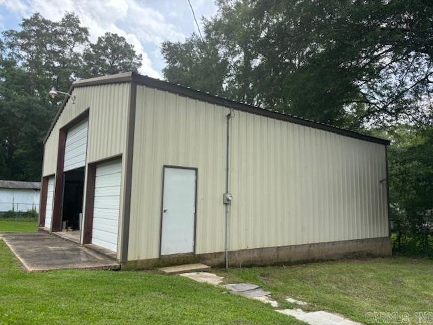 No mobile homes allowed.  Site built home only.  Flat lot.  A 36 x 40 shop on the property with 1 large bay door & 2 small bay doors.  Inside & outside water spigots.  Drain inside the shop.  A greenhouse also comes with the property.