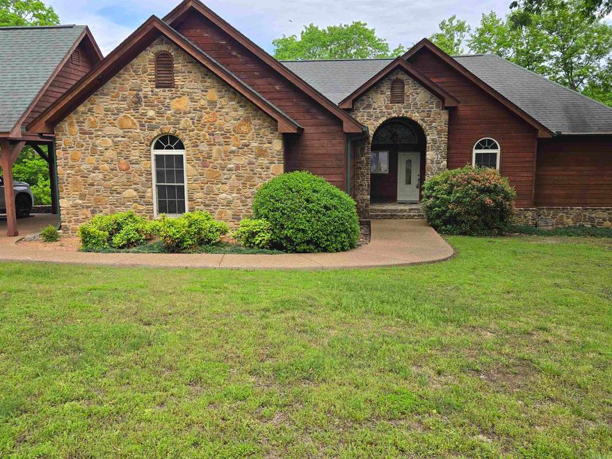 Fantastic Lakefront home. Right on the water with four bedrooms, four bathrooms, Private two slip boat dock with one lift and with solar power. Two car garage, three car carport. Wet Bar tons of room for pool table. media room. Rock steps out the back down to the dock. Covered back deck for outdoor cooking and enjoying life. Hop in your boat and cruise out to a 40-thousand-acre Lake. Plenty of golf courses, 90 miles of ATV Trails. Fairfield Bay Marina is only 3 miles away. Plus, plenty of fishing right off the dock. RV pad for those who like to travel. Everything is here to bring your family and friends to have a great time away from it all. Very quiet and seclude area. Mostly retired couples and summer homes in this area. There are hardwood floors upstairs and crown molding in every room plus stamped concrete on the patio. The outside carport could be closed in for three garages. No HOA fees. House next to the Lake with your own private two slip Dock is really hard to find. Don't let this one get away. There are steps down to the Boat Dock. Perfect setup. Sellers are MOTIVATED!!!
